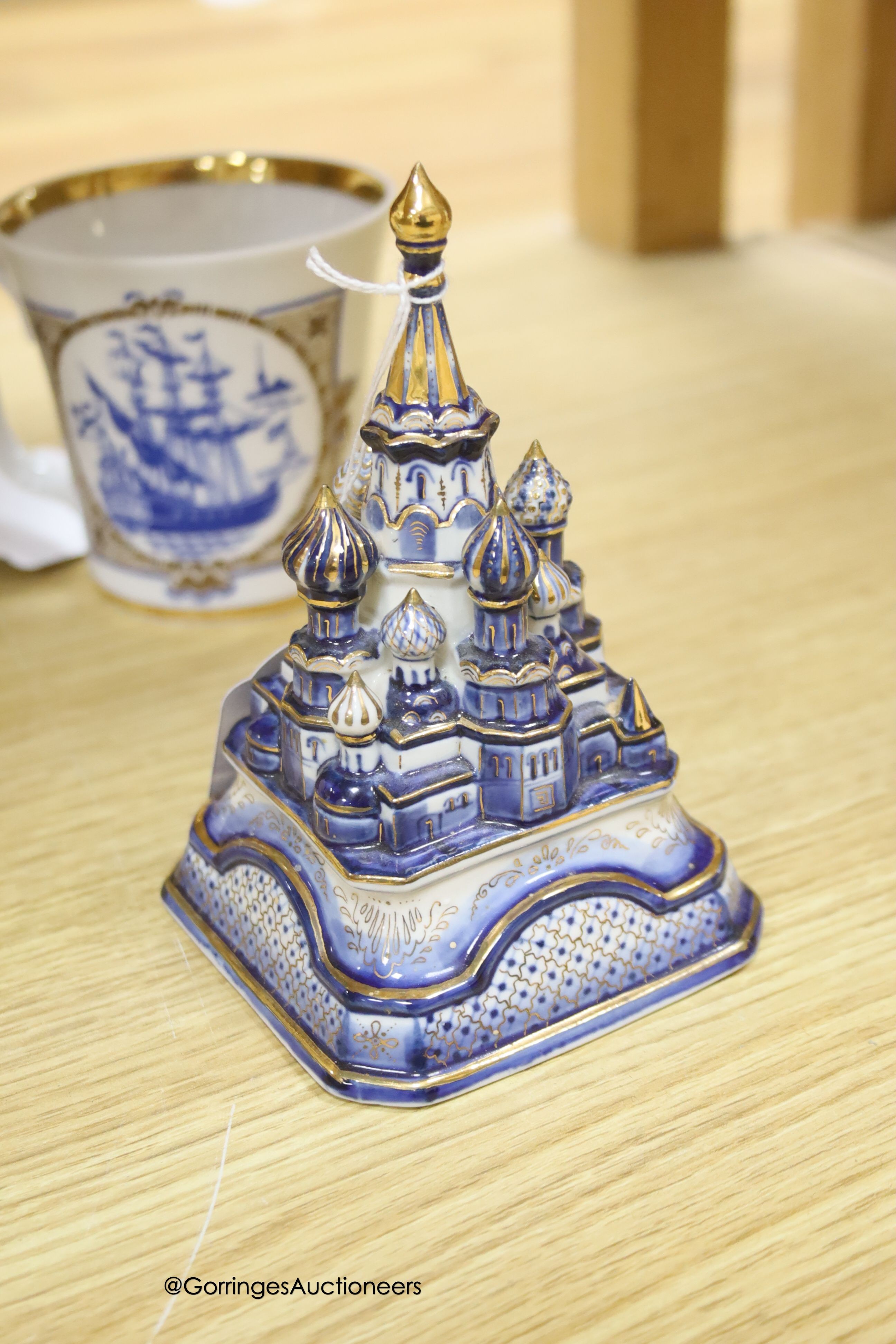 A Russian gilt samovar painted with flowers and a small collection of Russian ceramics